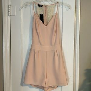 Bebe romper, never worn, tags on